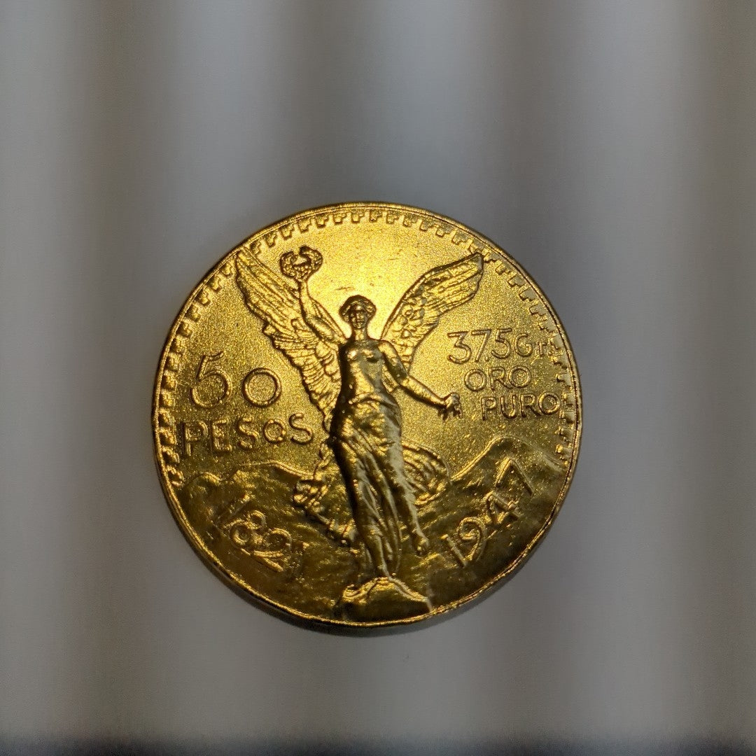 K1 41,60 GRMS - DTO. 0,00 GRMS - 21 K - AVALÚO 77688,00 * IDENTIFICACIÓN MONEDA NOMINATIVA * MONEDAS PESOS 50 PESOS (SEMINUEVO)