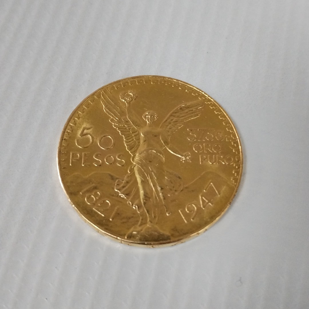 K1 41.6 GRMS - DESC. 0 GRAMOS - 21 K - AVALÚO 77688 * * IDENTIFICACIÓN MONEDA NOMINATIVA. * MONEDAS PESOS 50 PESOS. (SEMINUEVO)