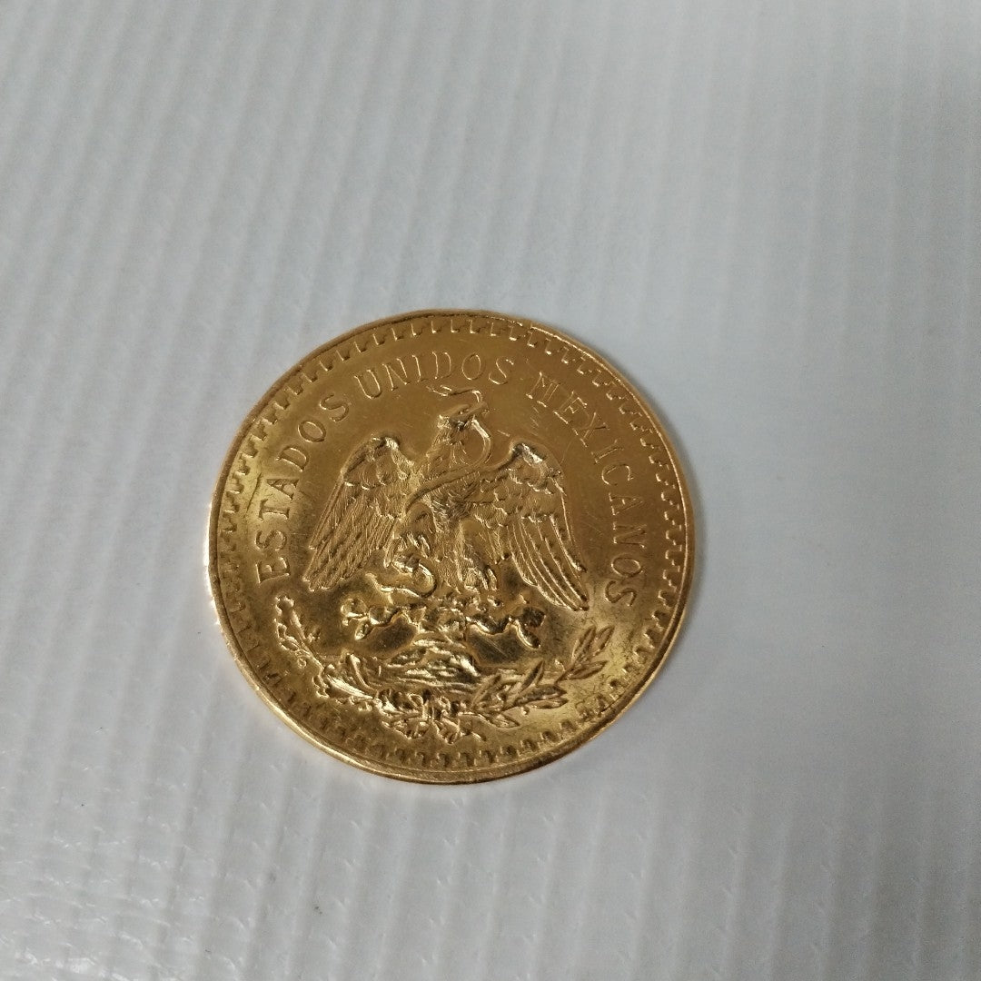 K1 41.6 GRMS - DESC. 0 GRAMOS - 21 K - AVALÚO 77688 * * IDENTIFICACIÓN MONEDA NOMINATIVA. * MONEDAS PESOS 50 PESOS. (SEMINUEVO)