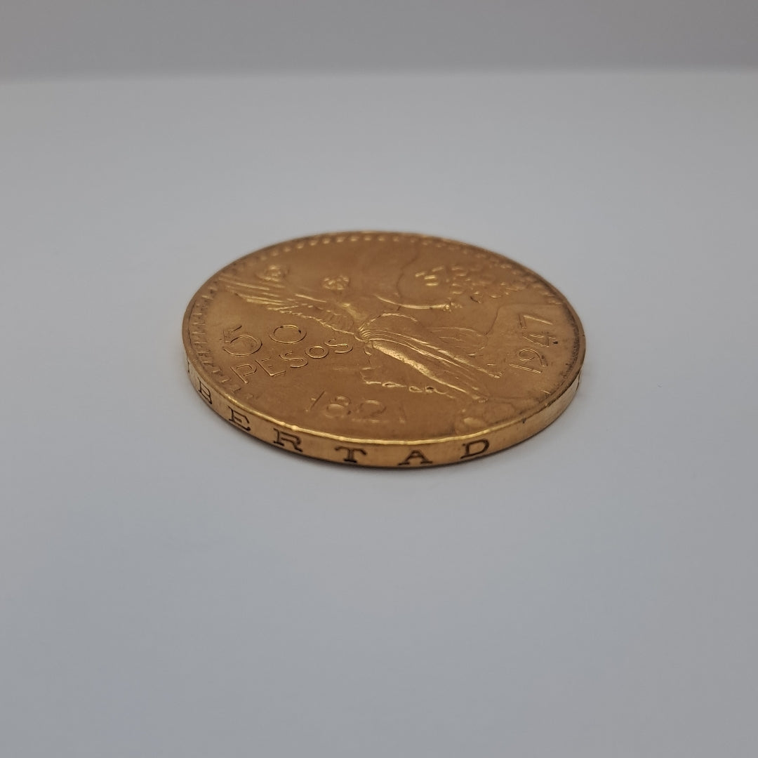 K1 41,60 GRMS - DTO. 0,00 GRMS - 21 K - AVALÚO 79372,80 * IDENTIFICACIÓN MONEDA NOMINATIVA * MONEDAS PESOS 50 PESOS (SEMINUEVO)