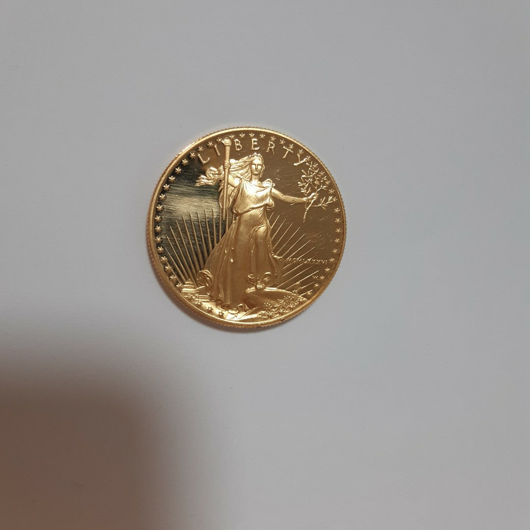 K1 34,10 GRMS - DTO. 0,00 GRMS - 21 K - AVALÚO 53400,60 * IDENTIFICACIÓN  MONEDA NOMINATIVA * MATERIALES  ORO * ESPECI (SEMINUEVO)