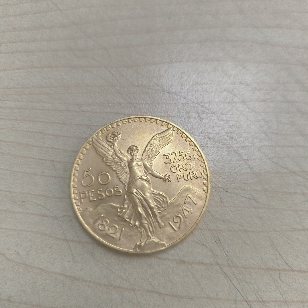 K1 41,60 GRMS - DTO. 0,00 GRMS - 21 K - AVALÚO 71884,80 * IDENTIFICACIÓN  MONEDA NOMINATIVA * MONEDAS PESOS  50 PESOS (SEMINUEVO)