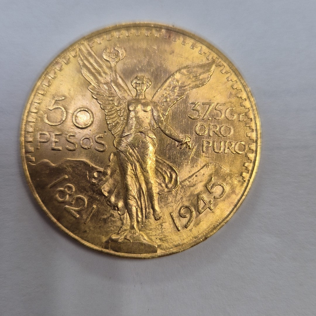 K1 41,60 GRMS - DTO. 0,00 GRMS - 21 K - AVALÚO 80870,40 * IDENTIFICACIÓN  MONEDA NOMINATIVA * MONEDAS PESOS  50 PESOS (SEMINUEVO)