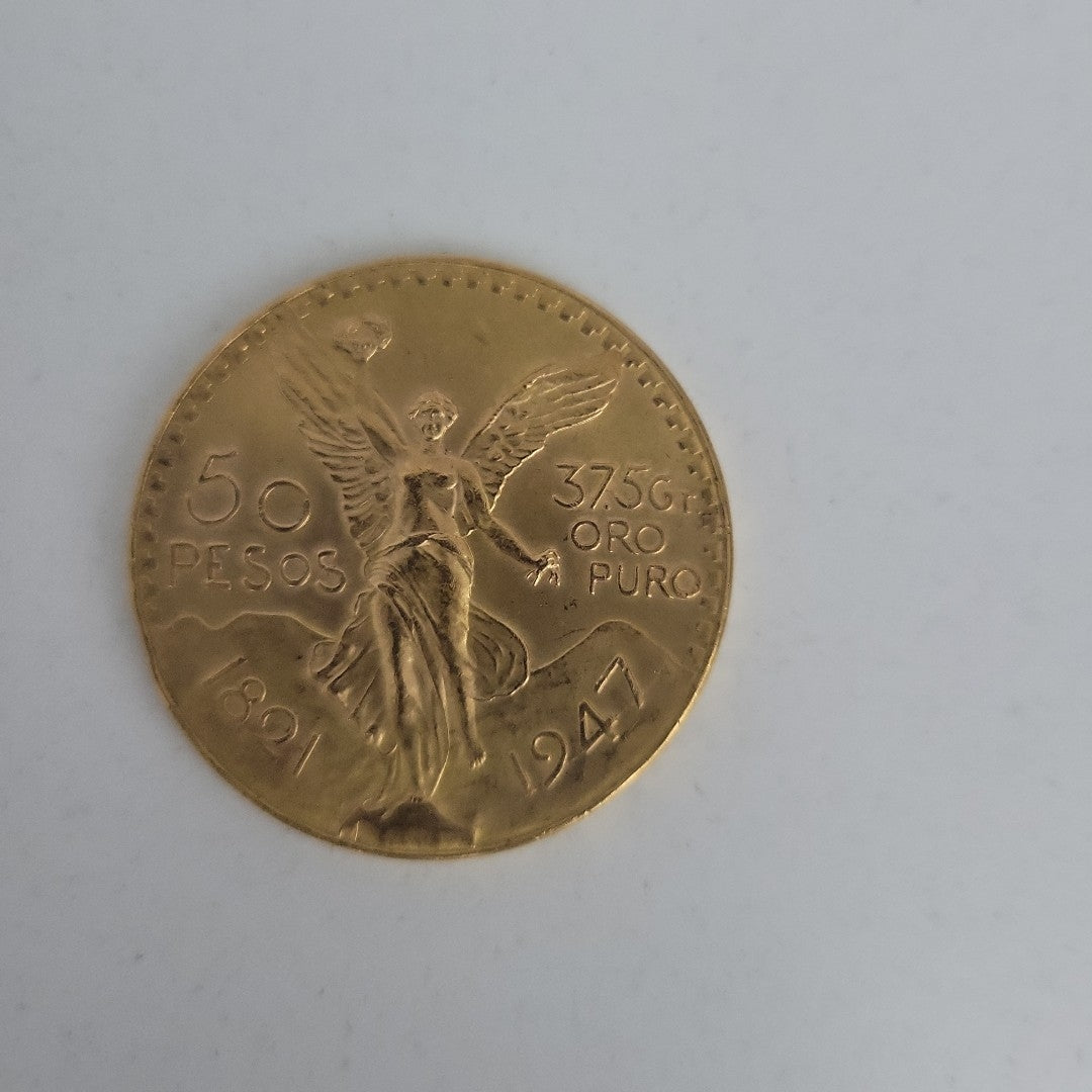 K1 41.6 GRMS - DESC.  0 GRAMOS - 21 K - AVALÚO  71884.8 * * IDENTIFICACIÓN  MONEDA NOMINATIVA. * MONEDAS PESOS  50 PESO (SEMINUEVO)