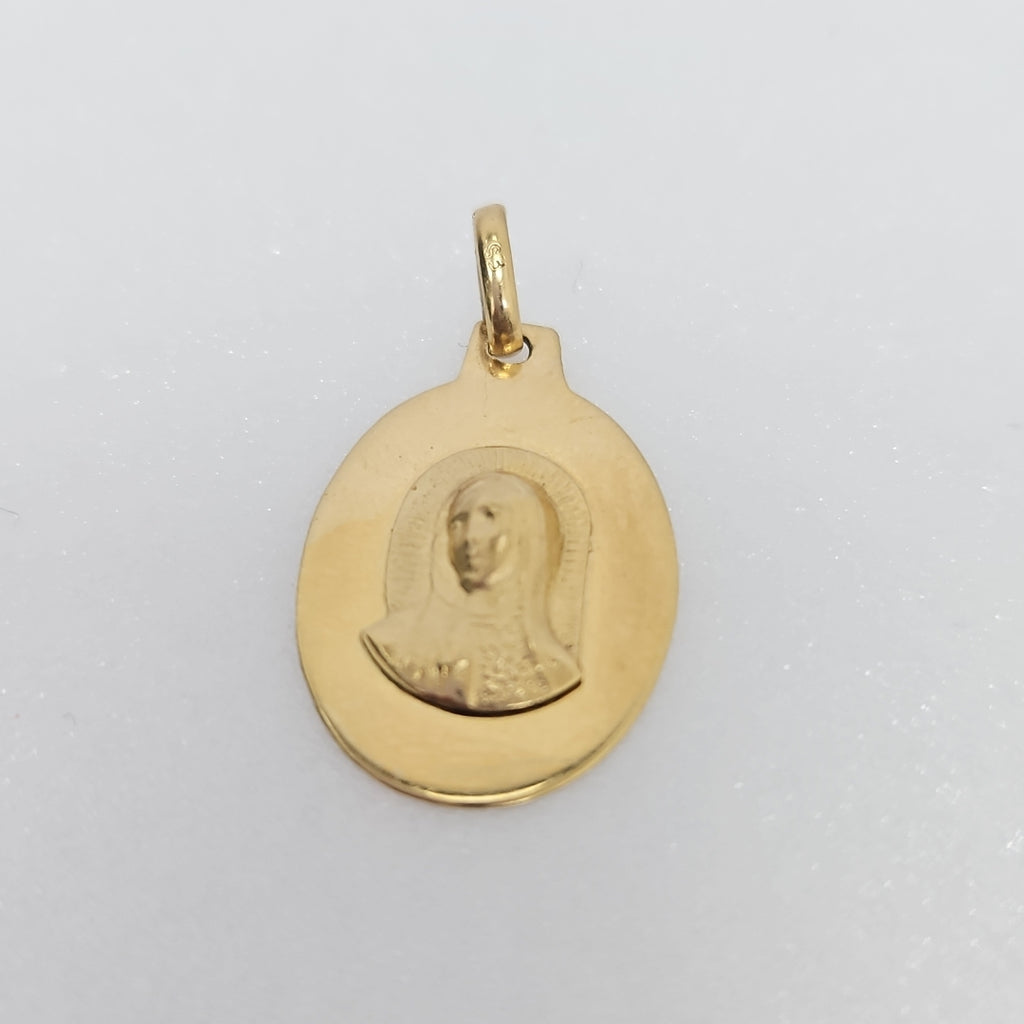 10007REL12000B120 FRD3 MEDALLA OVALADA CON IMAGEN DE LA VIRGEN AL RELIEVE ORO 14K 1.2GRS (NUEVO)