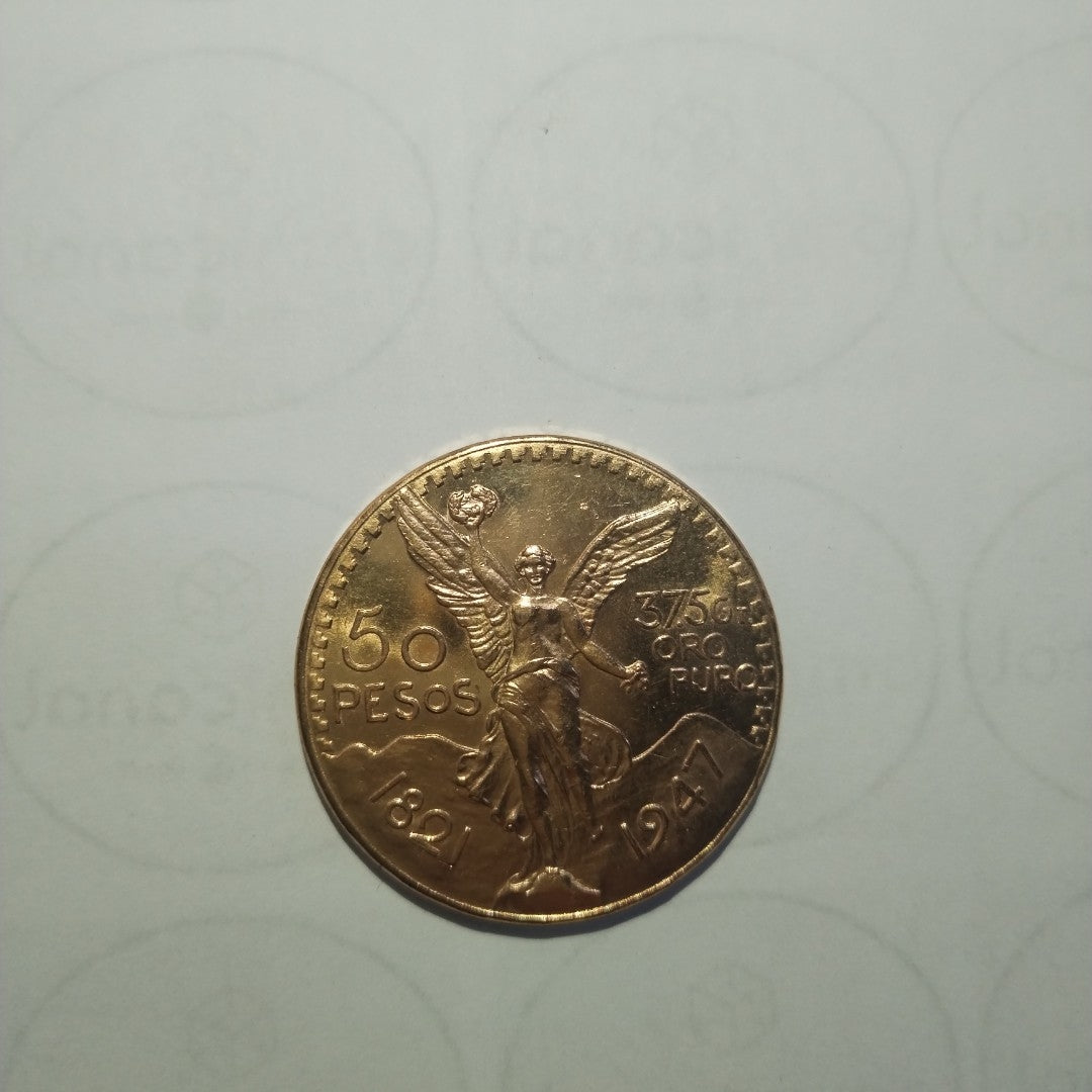 K1 41,60 GRMS - DTO. 0,00 GRMS - 21 K - AVALÚO 76003,20 * IDENTIFICACIÓN  MONEDA NOMINATIVA * MONEDAS PESOS  50 PESOS (SEMINUEVO)