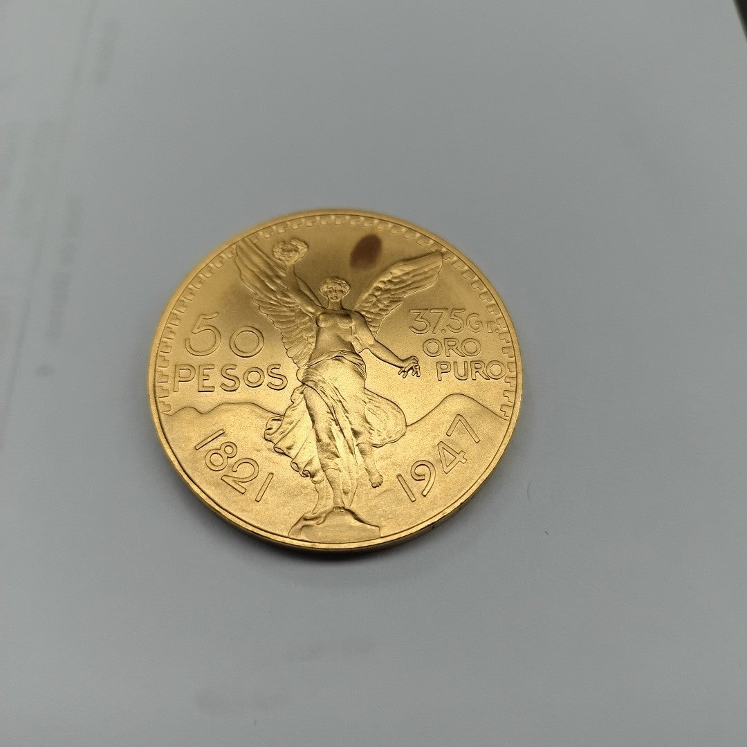 K1 41.6 GRMS - DESC.  0 GRAMOS - 21 K - AVALÚO  77126.4 * * IDENTIFICACIÓN  MONEDA NOMINATIVA. * MONEDAS PESOS  50 PESO (SEMINUEVO)
