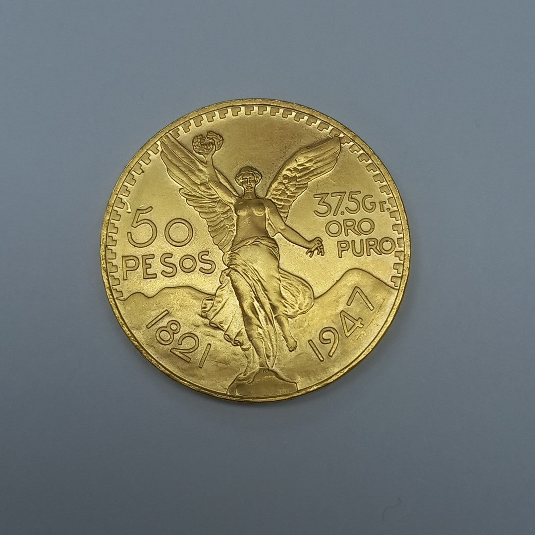K1 41.6 GRMS - DESC.  0 GRAMOS - 21 K - AVALÚO  69638.4 * * IDENTIFICACIÓN  MONEDA NOMINATIVA. * MONEDAS PESOS  50 PESO (SEMINUEVO)