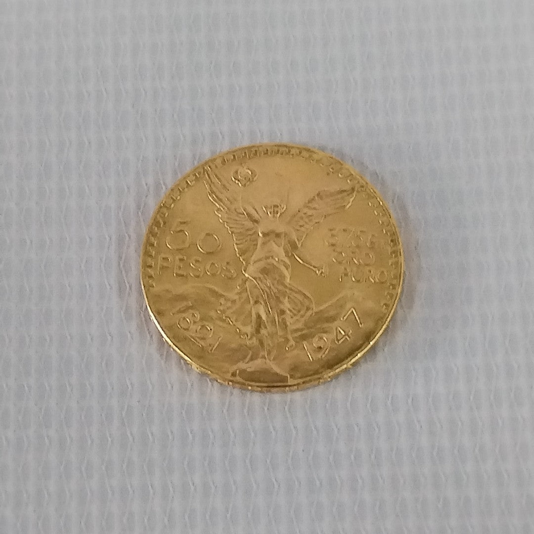 K1 41.6 GRMS - DESC. 0 GRAMOS - 21 K - AVALÚO 74131.2 * * IDENTIFICACIÓN MONEDA NOMINATIVA. * MONEDAS PESOS 50 PESO (SEMINUEVO)