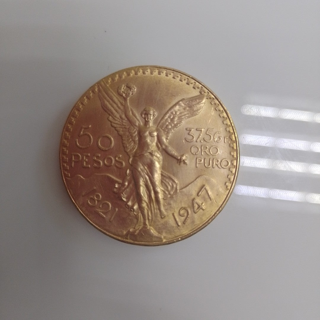 K1 41,60 GRMS - DTO. 0,00 GRMS - 21 K - AVALÚO 76003,20 * IDENTIFICACIÓN MONEDA NOMINATIVA * MONEDAS PESOS 50 PESOS (SEMINUEVO)