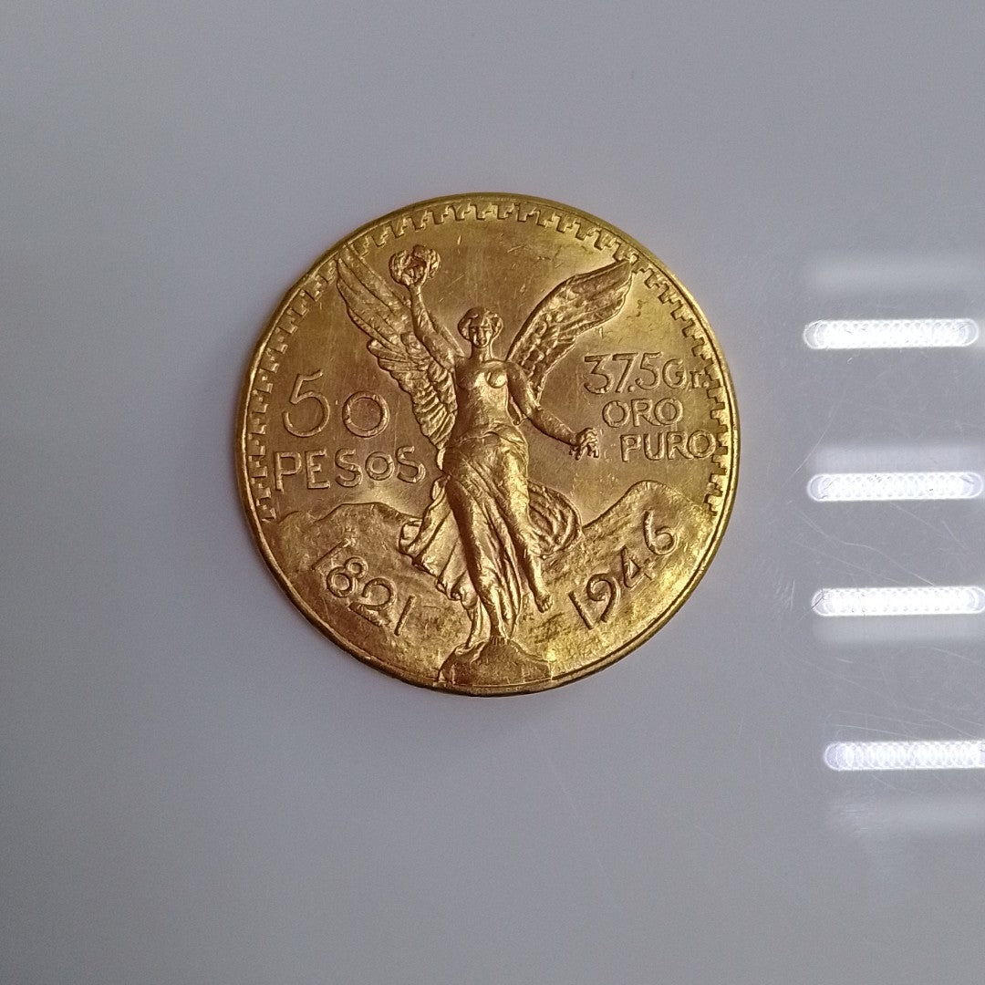 K1 41,60 GRMS - DTO. 0,00 GRMS - 21 K - AVALÚO 76003,20 * IDENTIFICACIÓN MONEDA NOMINATIVA * MONEDAS PESOS 50 PESOS (SEMINUEVO)