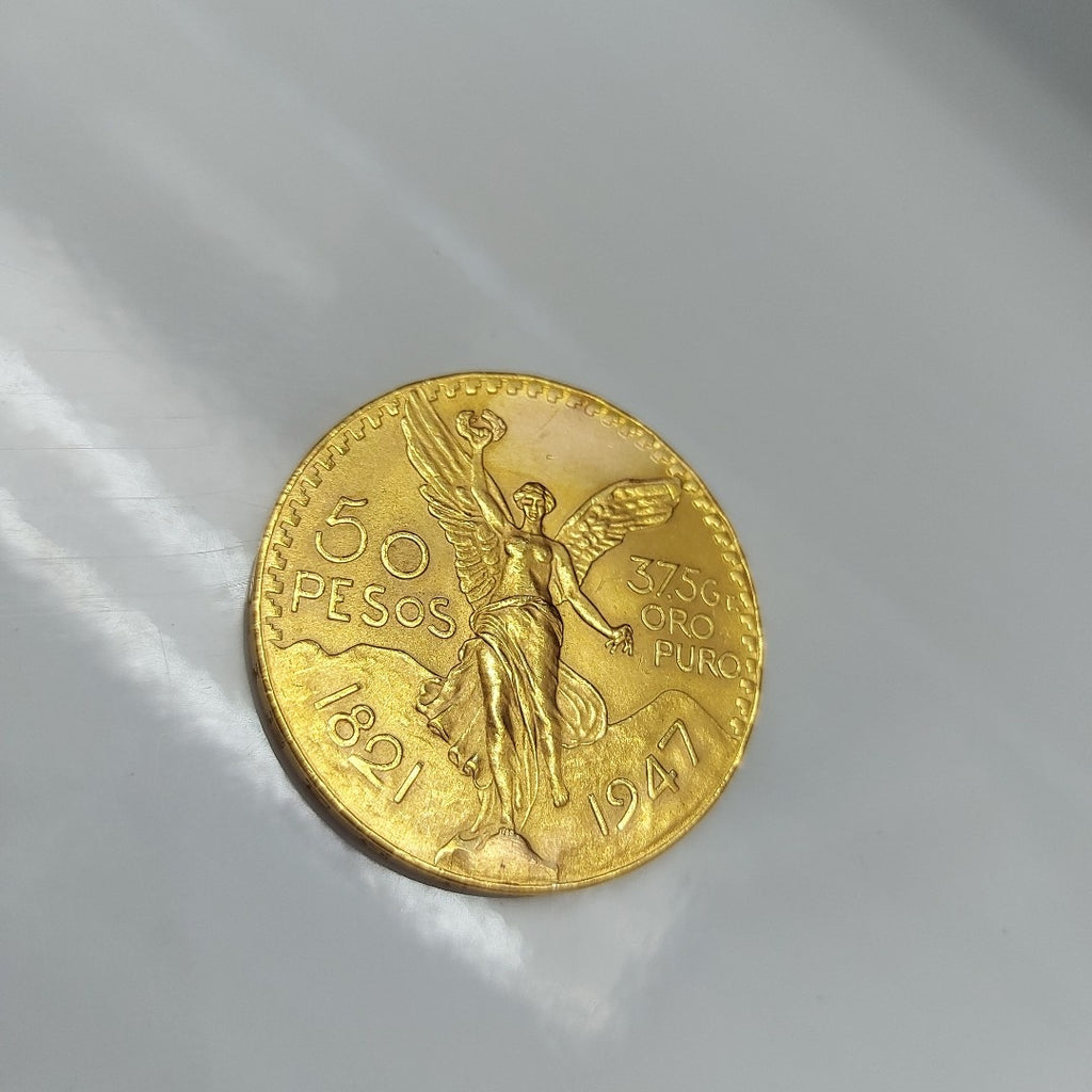 K1 41,60 GRMS - DTO. 0,00 GRMS - 21 K - AVALÚO 76003,20 * IDENTIFICACIÓN MONEDA NOMINATIVA * MONEDAS PESOS 50 PESOS (SEMINUEVO)