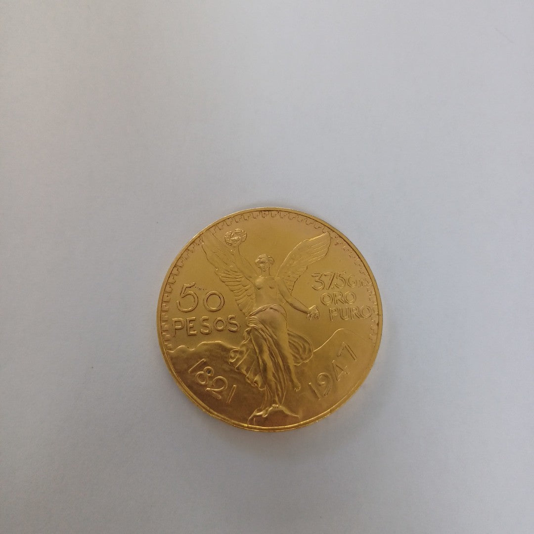 K1 41.6 GRMS - DESC. 0 GRAMOS - 21 K - AVALÚO 71884.8 * * IDENTIFICACIÓN MONEDA NOMINATIVA. * MONEDAS PESOS 50 PESO (SEMINUEVO)