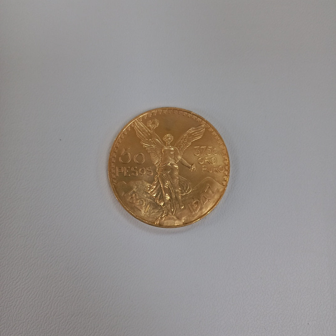 K1 41.6 GRMS - DESC. 0 GRAMOS - 21 K - AVALÚO 75254.4 * * IDENTIFICACIÓN MONEDA NOMINATIVA. * MONEDAS PESOS 50 PESO (SEMINUEVO)