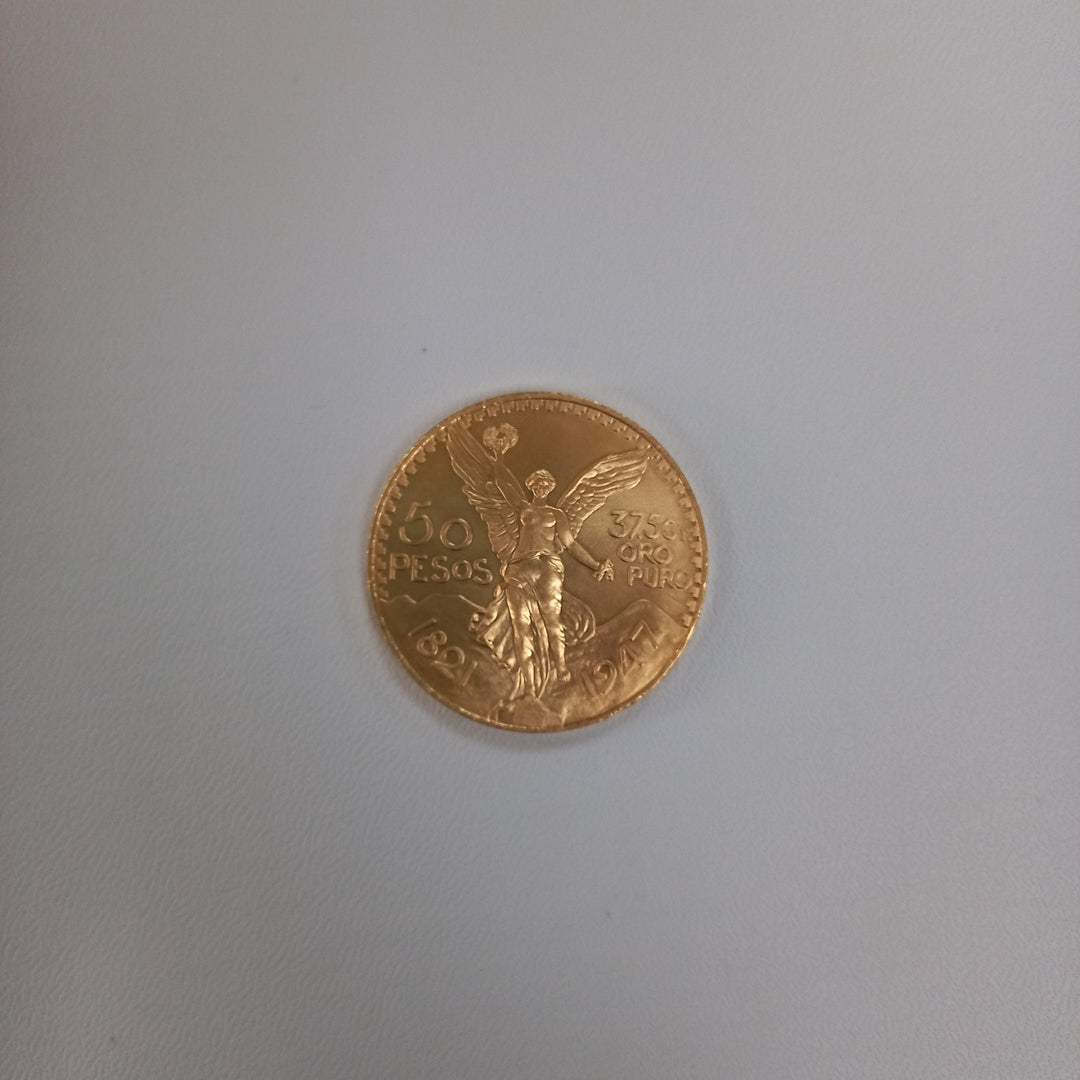 K1 41.6 GRMS - DESC. 0 GRAMOS - 21 K - AVALÚO 75254.4 * * IDENTIFICACIÓN MONEDA NOMINATIVA. * MONEDAS PESOS 50 PESO (SEMINUEVO)