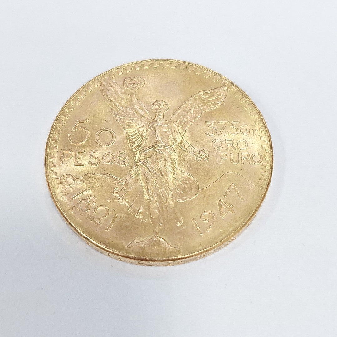 K1 41.6 GRMS - DESC. 0 GRAMOS - 21 K - AVALÚO 77126.4 * * IDENTIFICACIÓN MONEDA NOMINATIVA. * MONEDAS PESOS 50 PESO (SEMINUEVO)