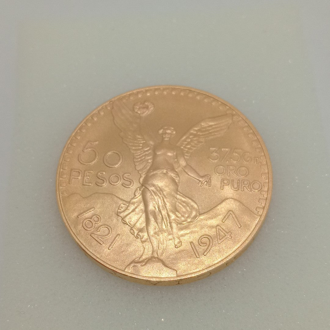 K1 41,60 GRMS - DTO. 0,00 GRMS - 21 K - AVALÚO 79534,21 * IDENTIFICACIÓN MONEDA NOMINATIVA * MONEDAS PESOS 50 PESOS (SEMINUEVO)