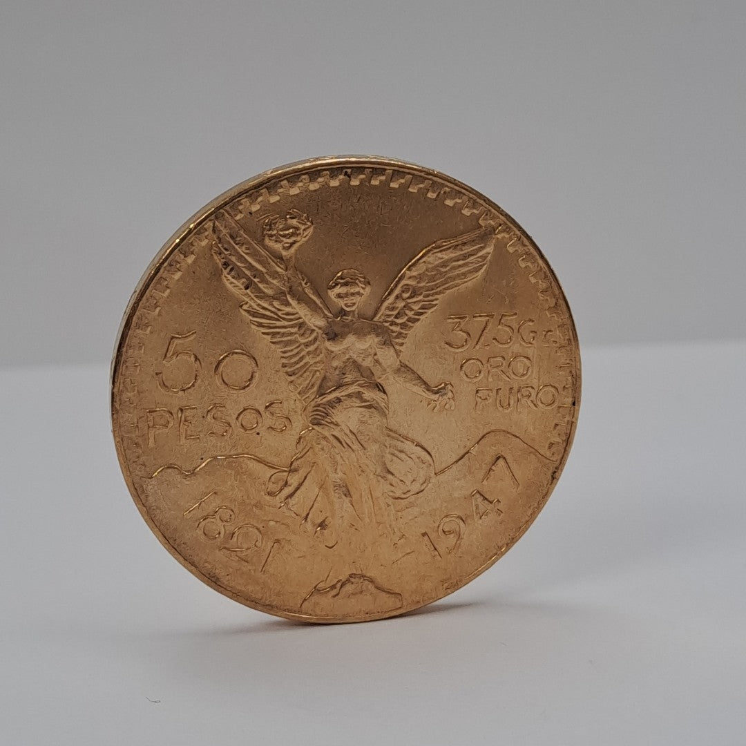 K1 41,50 GRMS - DTO. 0,00 GRMS - 21 K - AVALÚO 79343,02 * IDENTIFICACIÓN MONEDA NOMINATIVA * MONEDAS PESOS 50 PESOS (SEMINUEVO)