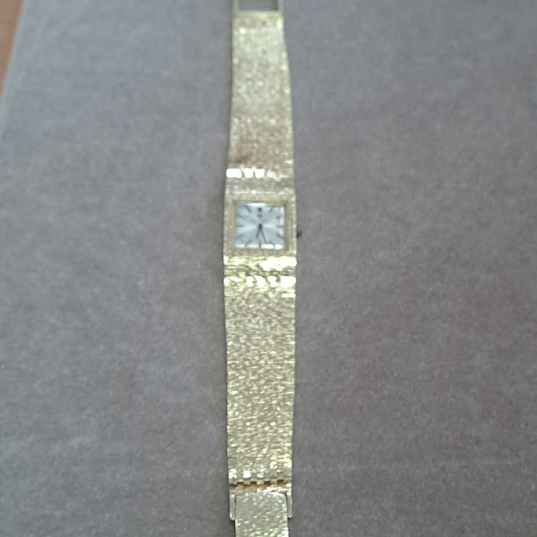 RELOJ CAJA Y PULSO ORO. ORO. 14 K 58.4 GRMS (SEMINUEVO)