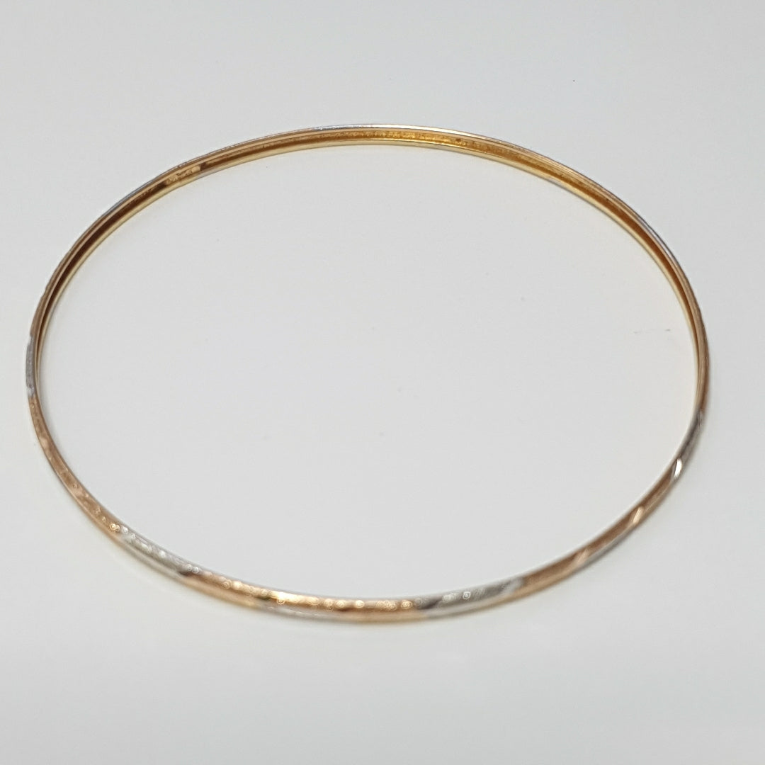 PULSERA RIGIDA ORO COMBINADO 10 K 3,30 GRMS (SEMINUEVO)