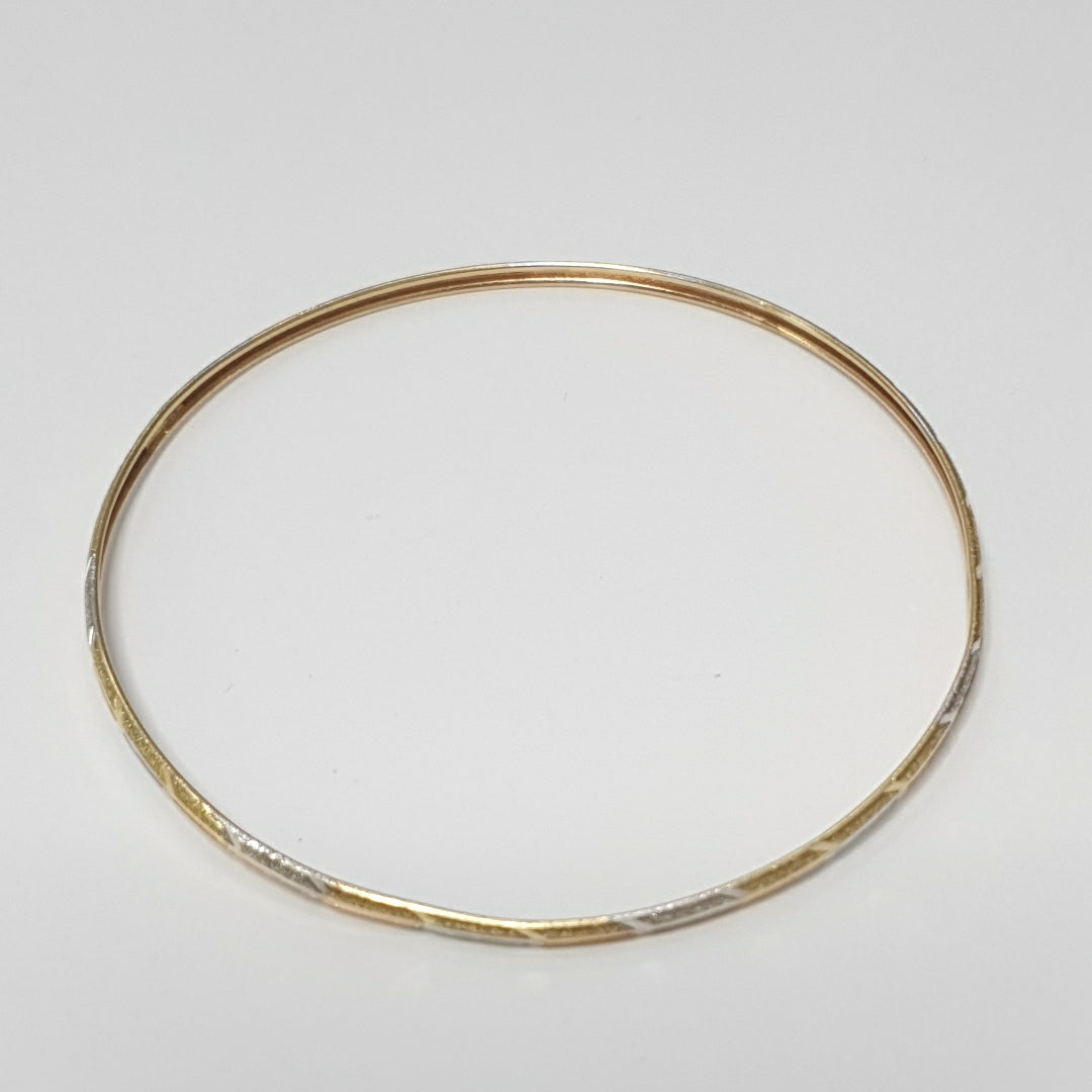 PULSERA RIGIDA ORO COMBINADO 10 K 3,40 GRMS (SEMINUEVO)