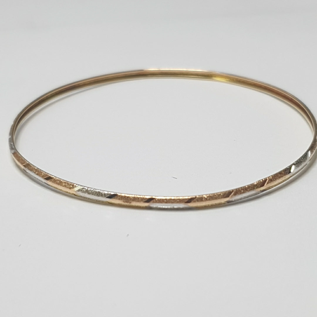 PULSERA RIGIDA ORO COMBINADO 10 K 3,30 GRMS (SEMINUEVO)