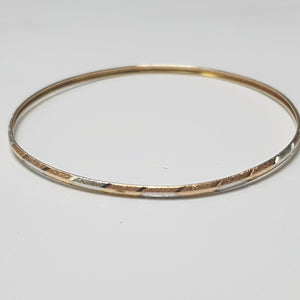 PULSERA RIGIDA ORO COMBINADO 10 K 3,30 GRMS (SEMINUEVO)
