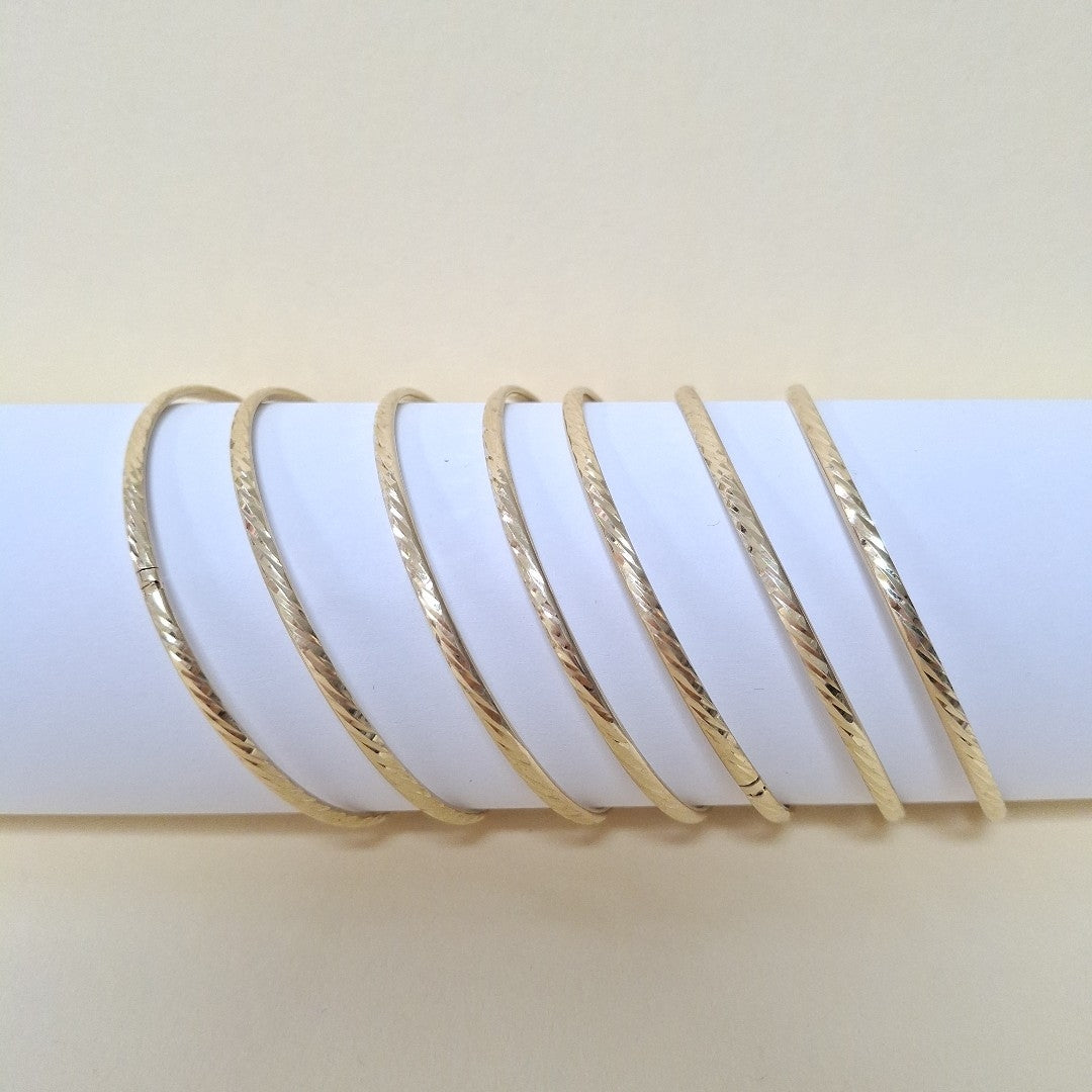 SEMANARIO DE ARGOLLAS,SEMANARIO DE PULSERAS ORO 10 K 22,90 GRMS (SEMINUEVO)