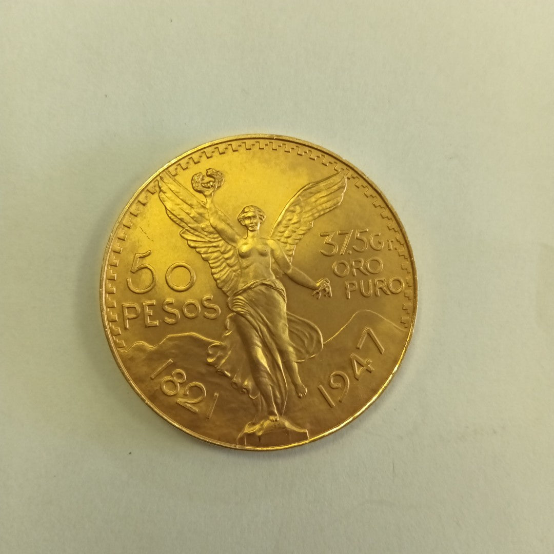 K1 41,60 GRMS - DTO. 0,00 GRMS - 21 K - AVALÚO 77126,40 * IDENTIFICACIÓN  MONEDA NOMINATIVA * MONEDAS PESOS  50 PESOS (SEMINUEVO)