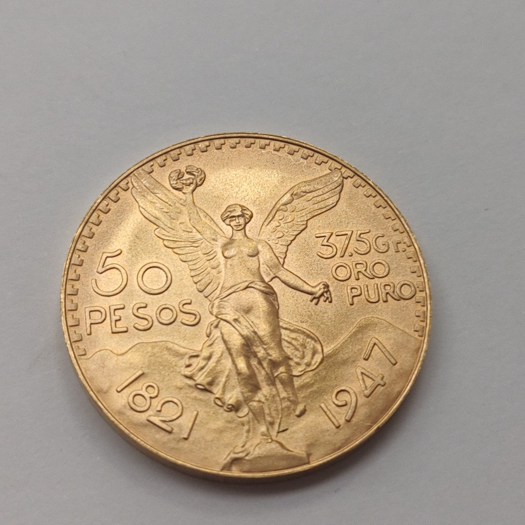 K1 41.6 GRMS - DESC.  0 GRAMOS - 21 K - AVALÚO  71884.8 * * IDENTIFICACIÓN  MONEDA NOMINATIVA. * MONEDAS PESOS  50 PESO (SEMINUEVO)