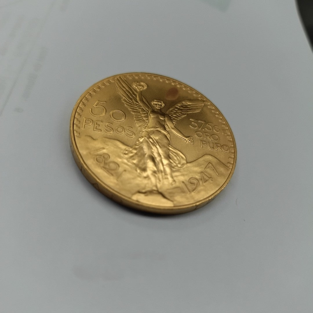 K1 41.6 GRMS - DESC.  0 GRAMOS - 21 K - AVALÚO  77126.4 * * IDENTIFICACIÓN  MONEDA NOMINATIVA. * MONEDAS PESOS  50 PESO (SEMINUEVO)