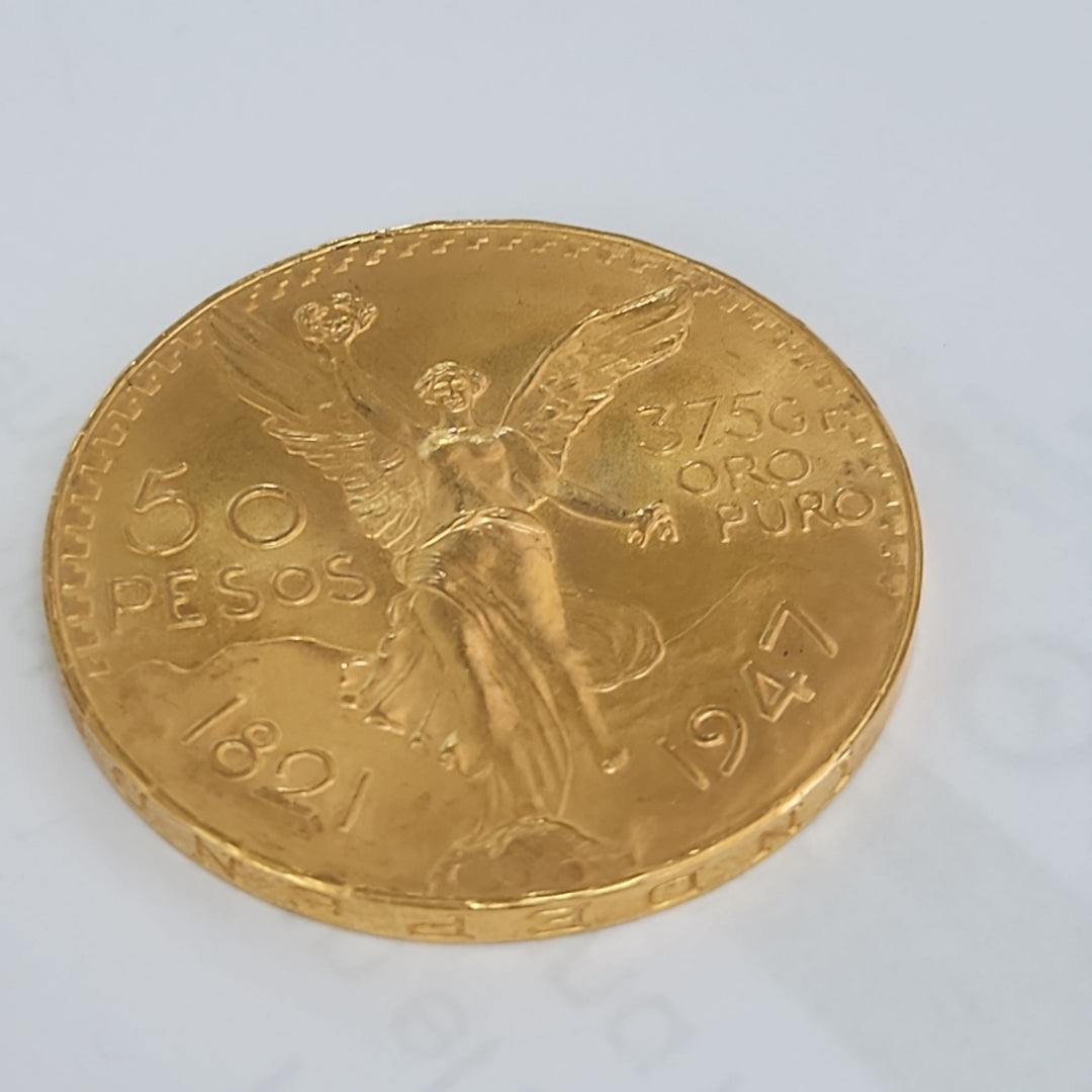 K1 41.6 GRMS - DESC. 0 GRAMOS - 21 K - AVALÚO 76377.6 * * IDENTIFICACIÓN MONEDA NOMINATIVA. * MONEDAS PESOS 50 PESO (SEMINUEVO)