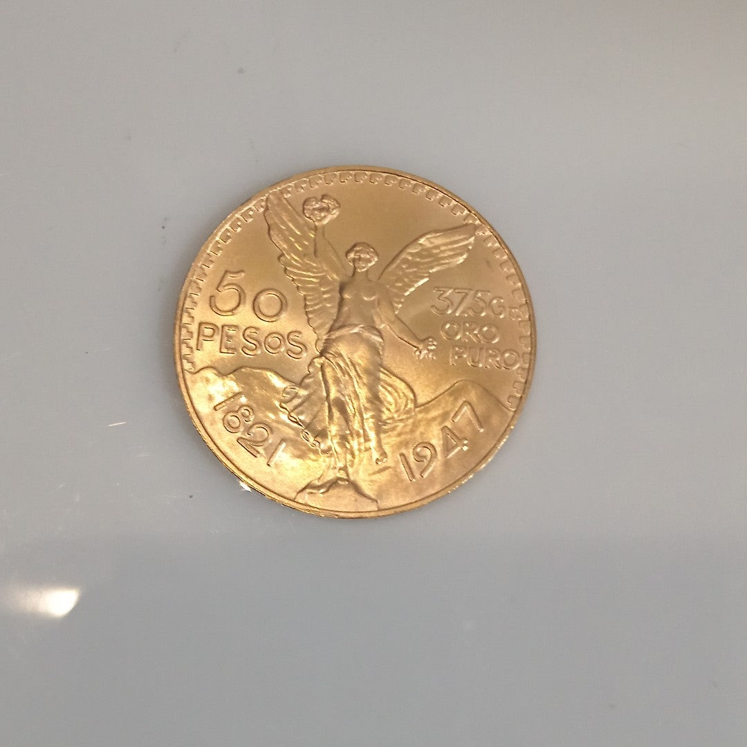 K1 41.6 GRMS - DESC. 0 GRAMOS - 21 K - AVALÚO 77126.4 * * IDENTIFICACIÓN MONEDA NOMINATIVA. * MONEDAS PESOS 50 PESO (SEMINUEVO)