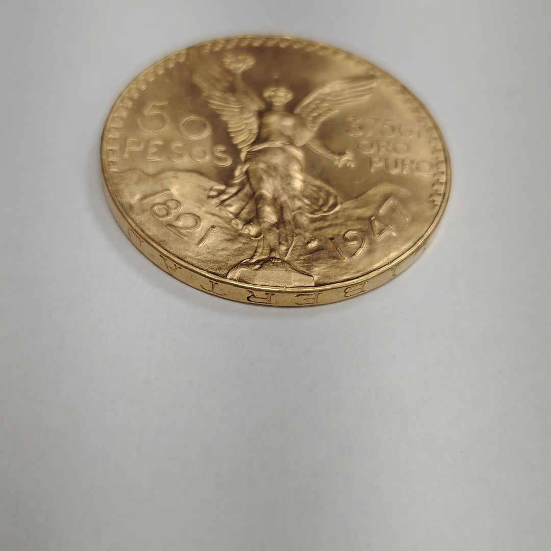 K1 41.6 GRMS - DESC. 0 GRAMOS - 21 K - AVALÚO 77126.4 * * IDENTIFICACIÓN MONEDA NOMINATIVA. * MONEDAS PESOS 50 PESO (SEMINUEVO)