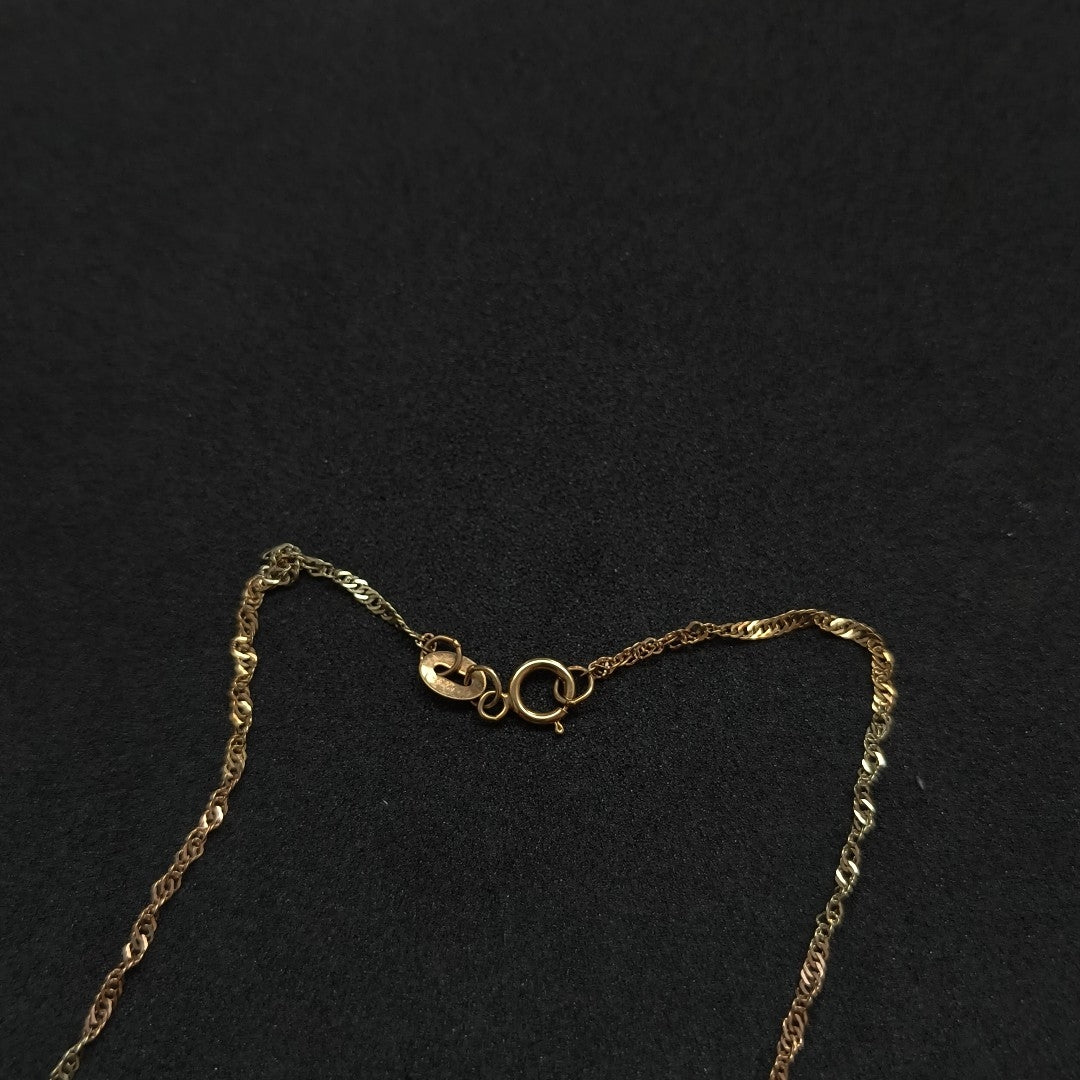 CADENA, DIJE ORO COMBINADO 10 K 1.9 GRMS (SEMINUEVO)