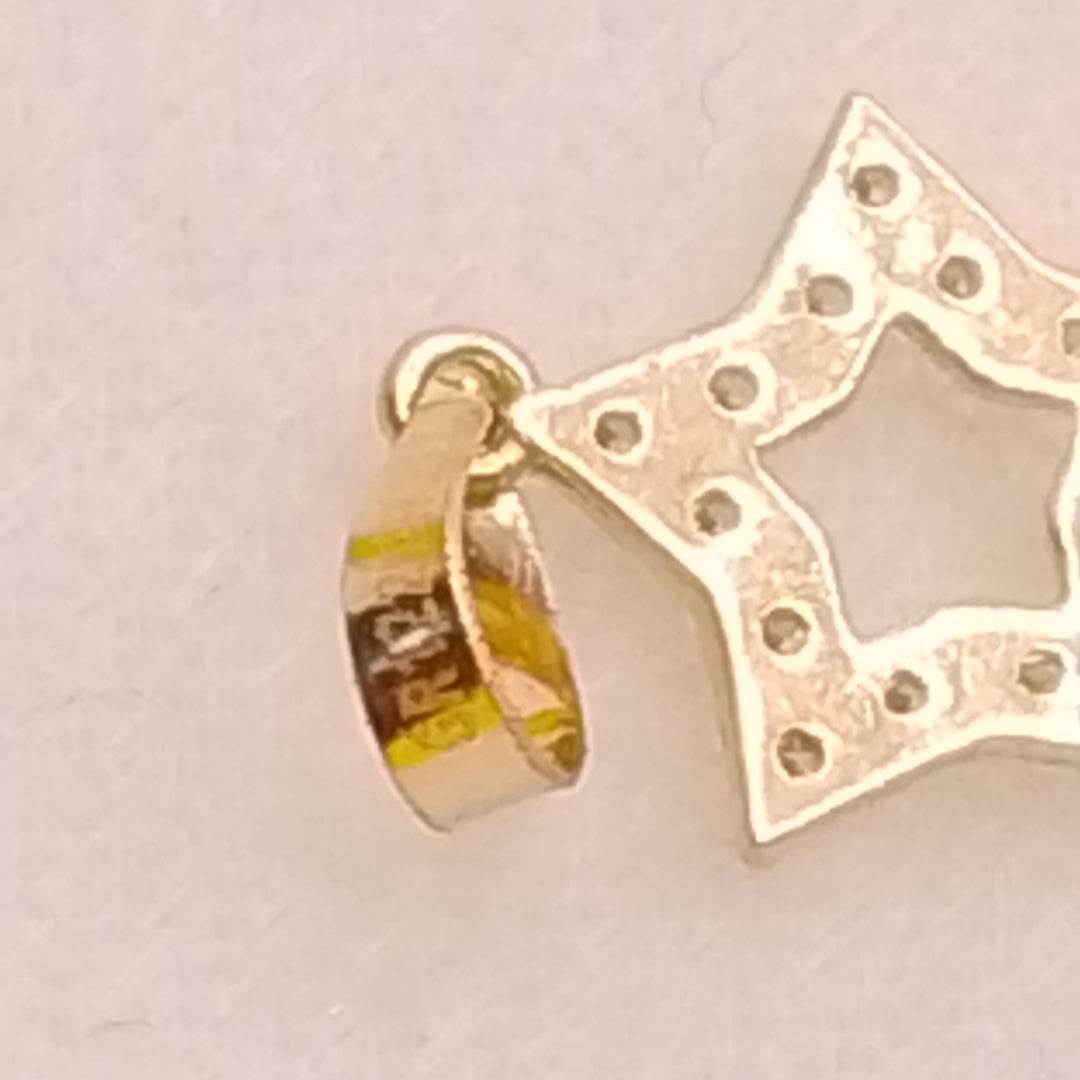 DIJES ESTRELLA C/CIRCONIAS ORO 10K 0.4 GR (NUEVO)