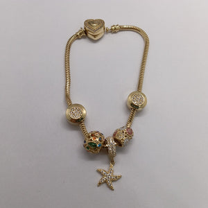 PULSERA CHARM ORO 14K 17.2 (NUEVO)