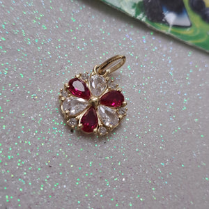 DIJE FLOR CIRCONIAS Y PIEDRAS DE COLOR 14K 2.8 GR (NUEVO)