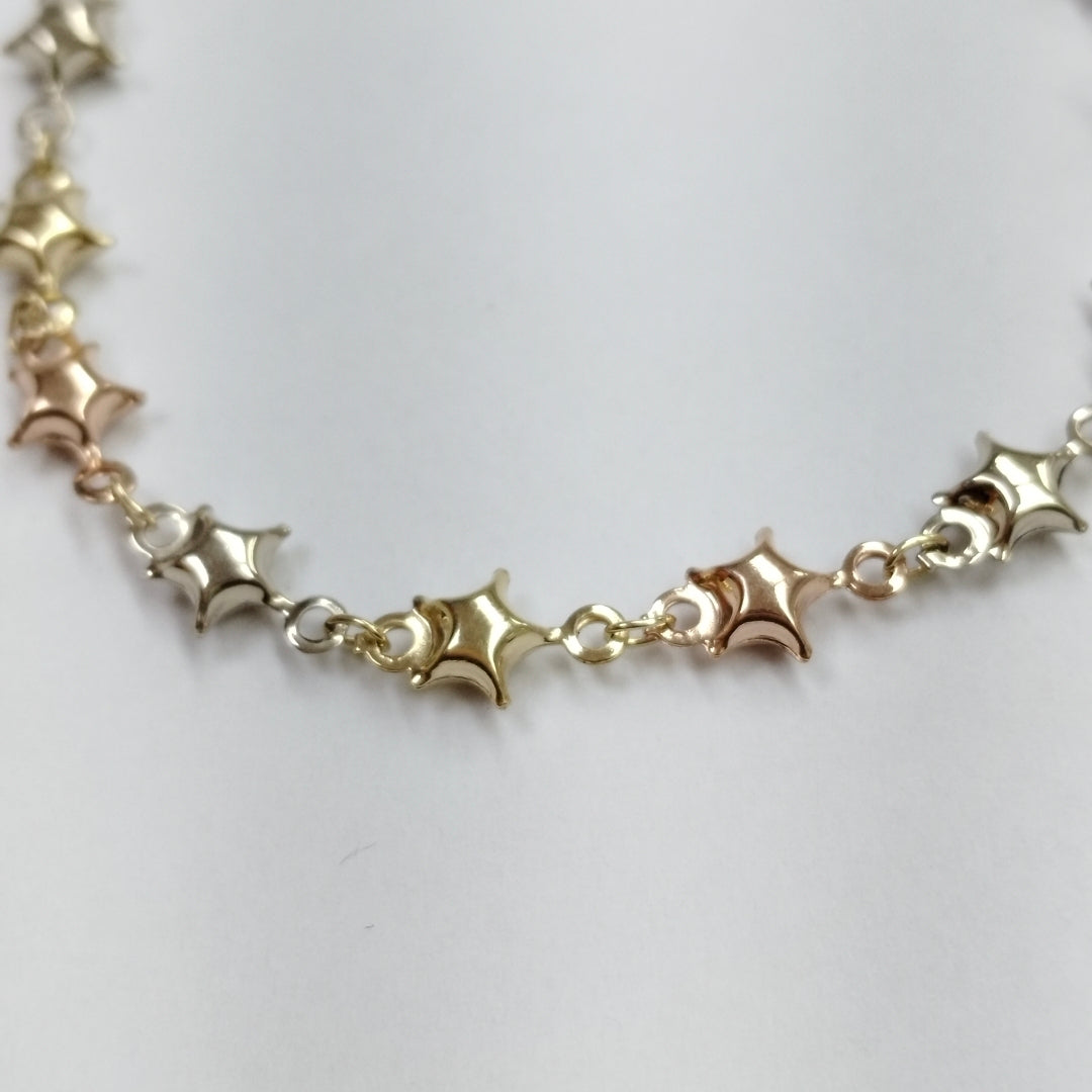 PULSERA TEJIDO ESPECIAL ESTRELLAS COMBINADAS 14K 18 CM 2.2 GR (NUEVO)