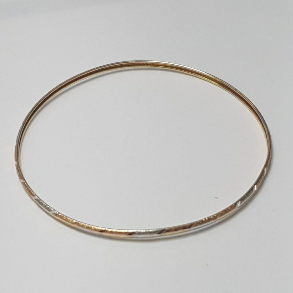 PULSERA RIGIDA ORO COMBINADO 10 K 3,20 GRMS (SEMINUEVO)