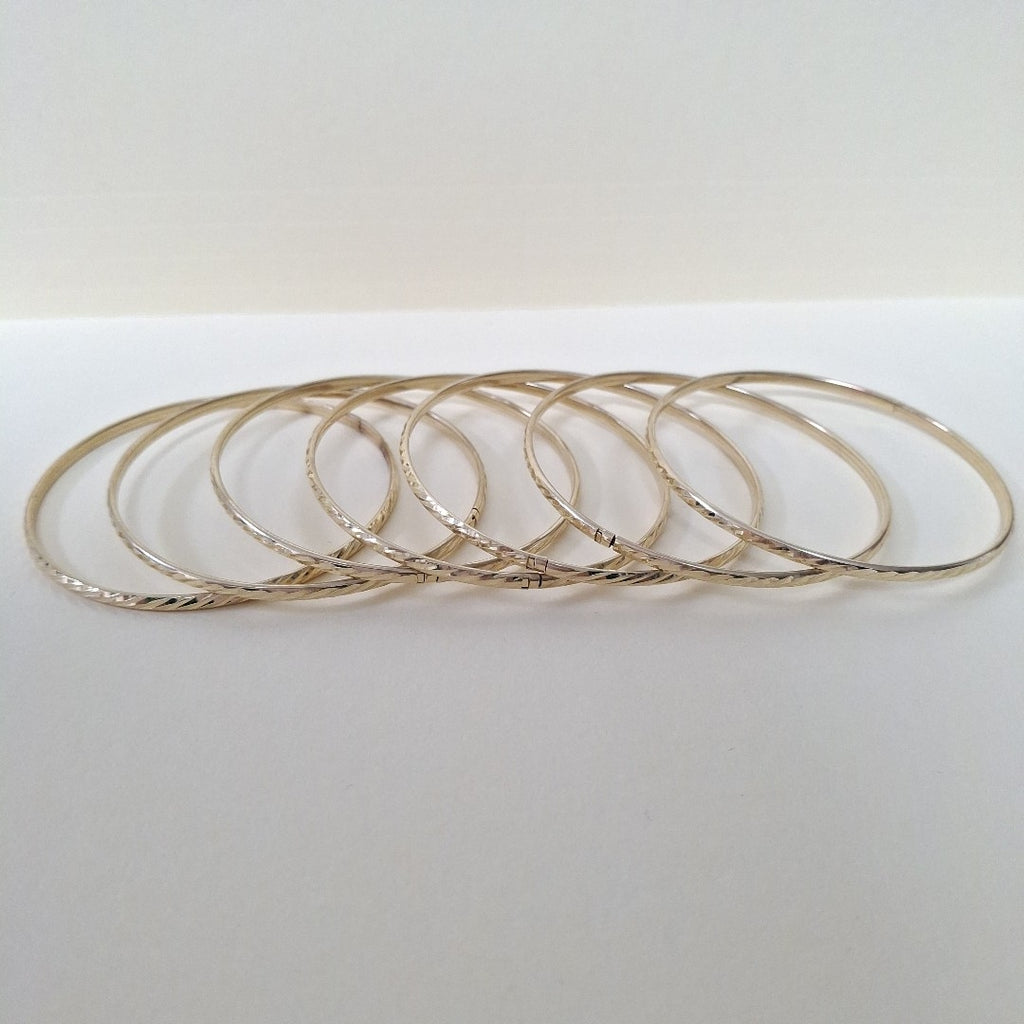 SEMANARIO DE ARGOLLAS,SEMANARIO DE PULSERAS ORO 10 K 22,90 GRMS (SEMINUEVO)