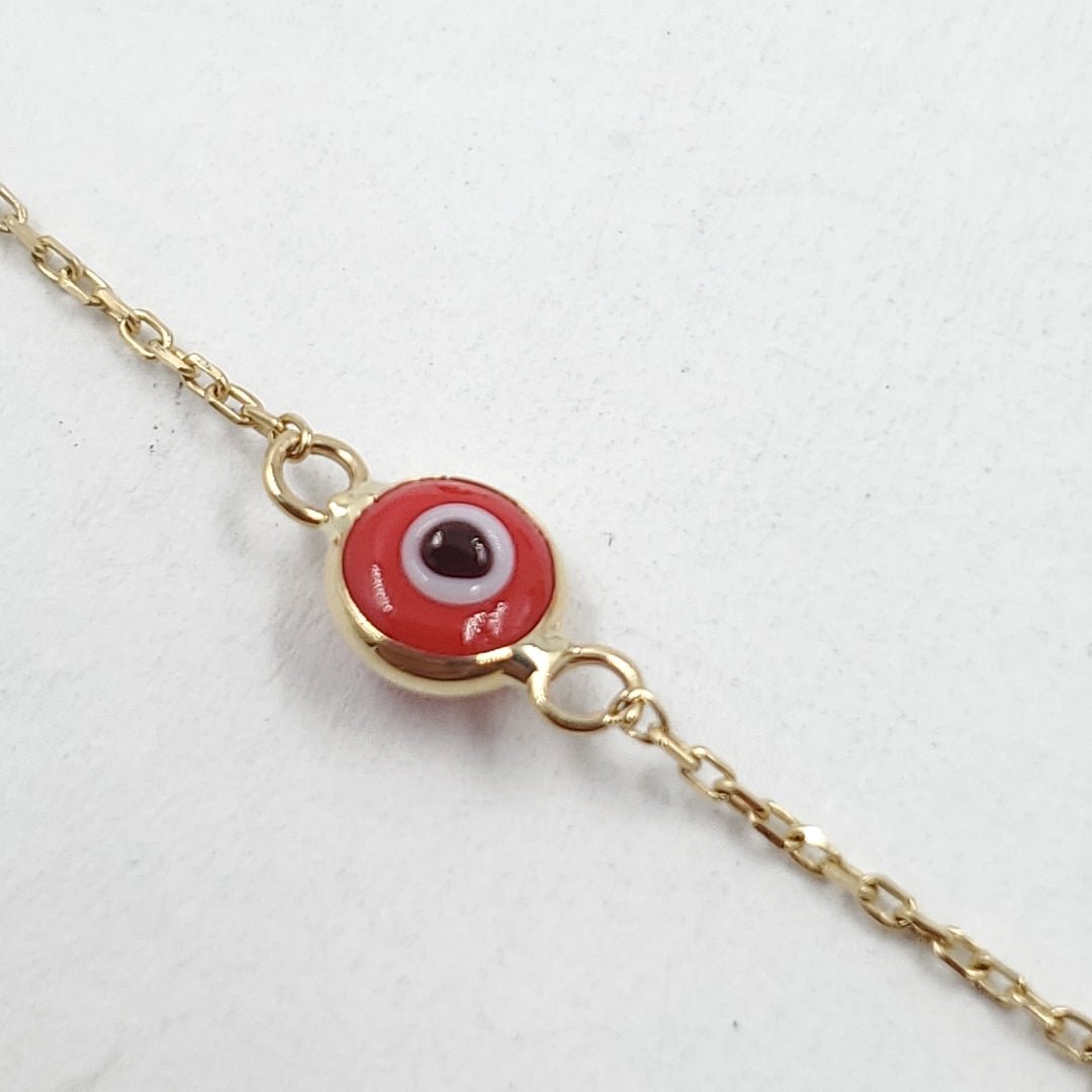 Pulsera para Dama Oro combinado 14 K 1.2 gr Tejido Especial &quot;Ojo turco&quot; con Sintetica color rojo (nuevo)