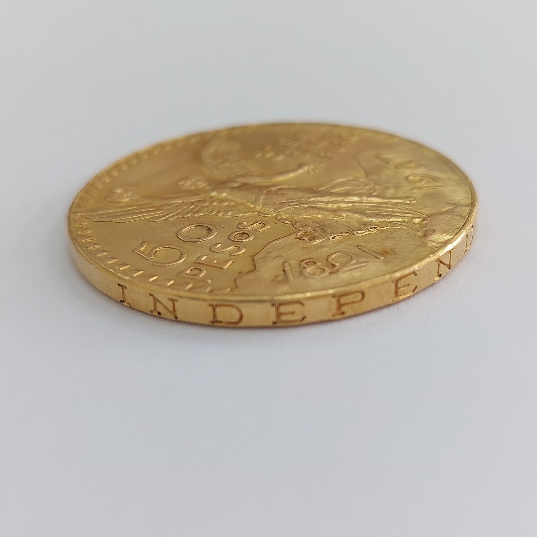 K1 41.6 GRMS - DESC.  0 GRAMOS - 21 K - AVALÚO  80870.4 * * IDENTIFICACIÓN  MONEDA NOMINATIVA. * MONEDAS PESOS  50 PESO (SEMINUEVO)