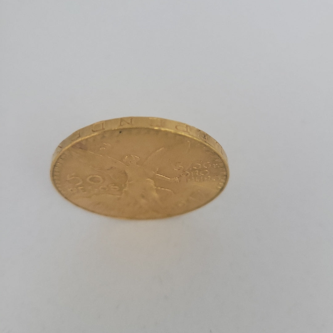 K1 41.6 GRMS - DESC.  0 GRAMOS - 21 K - AVALÚO  69638.4 * * IDENTIFICACIÓN  MONEDA NOMINATIVA. * MONEDAS PESOS  50 PESO (SEMINUEVO)