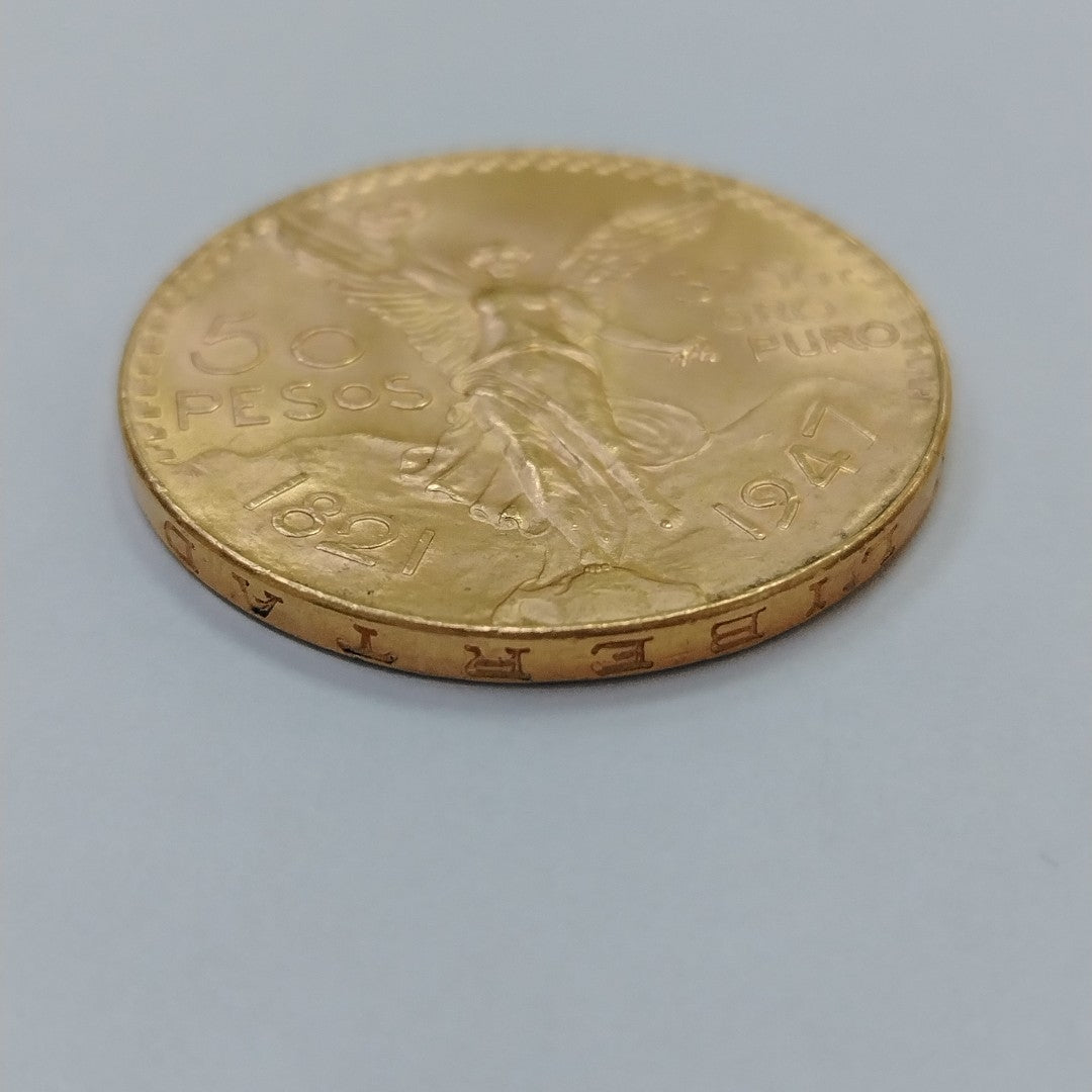 K1 41,60 GRMS - DTO. 0,00 GRMS - 21 K - AVALÚO 76003,20 * IDENTIFICACIÓN  MONEDA NOMINATIVA * MONEDAS PESOS  50 PESOS (SEMINUEVO)
