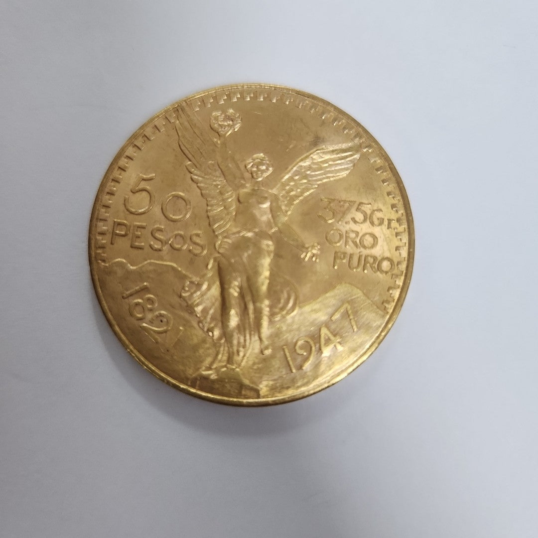 K1 41.6 GRMS - DESC. 0 GRAMOS - 21 K - AVALÚO 76377.6 * * IDENTIFICACIÓN MONEDA NOMINATIVA. * MONEDAS PESOS 50 PESO (SEMINUEVO)