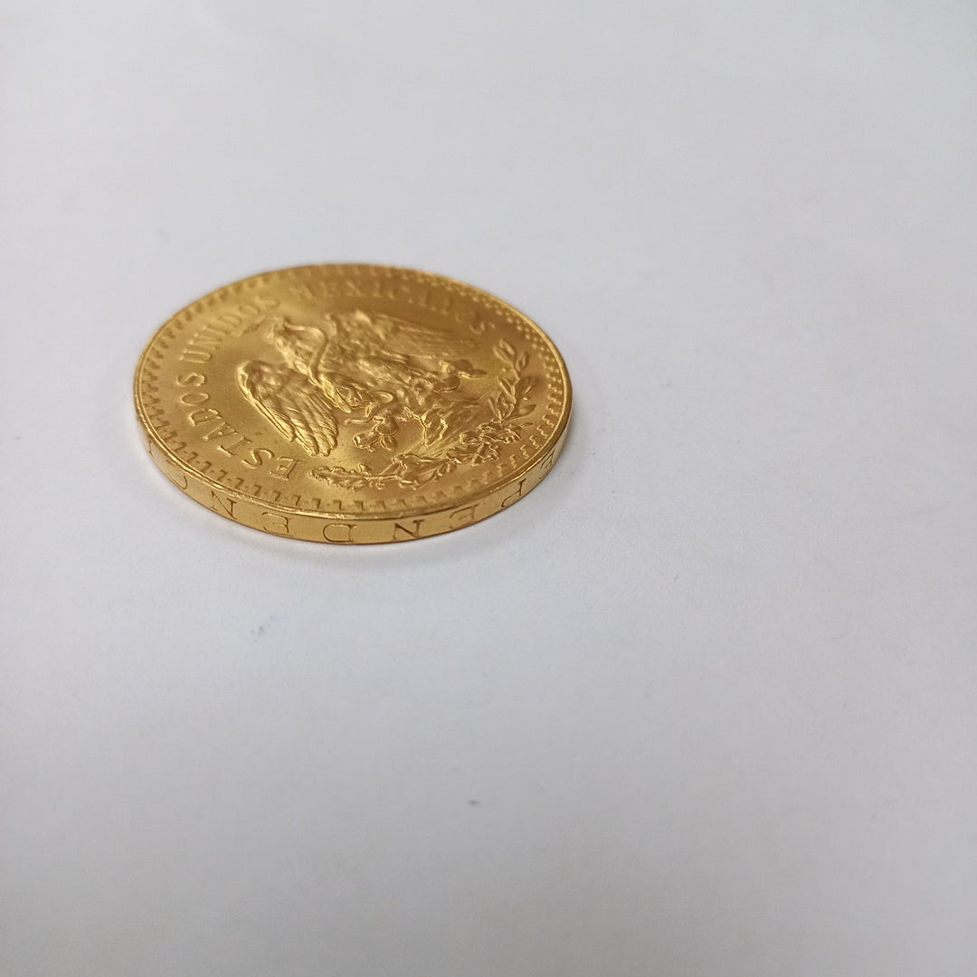 K1 41.6 GRMS - DESC. 0 GRAMOS - 21 K - AVALÚO 71884.8 * * IDENTIFICACIÓN MONEDA NOMINATIVA. * MONEDAS PESOS 50 PESO (SEMINUEVO)