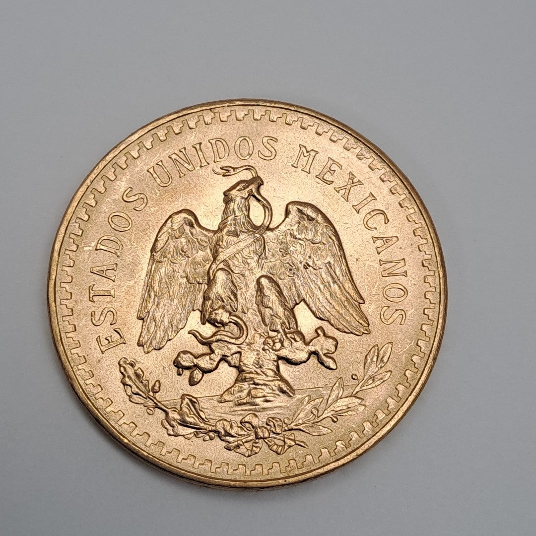 K1 41,50 GRMS - DTO. 0,00 GRMS - 21 K - AVALÚO 79343,02 * IDENTIFICACIÓN MONEDA NOMINATIVA * MONEDAS PESOS 50 PESOS (SEMINUEVO)