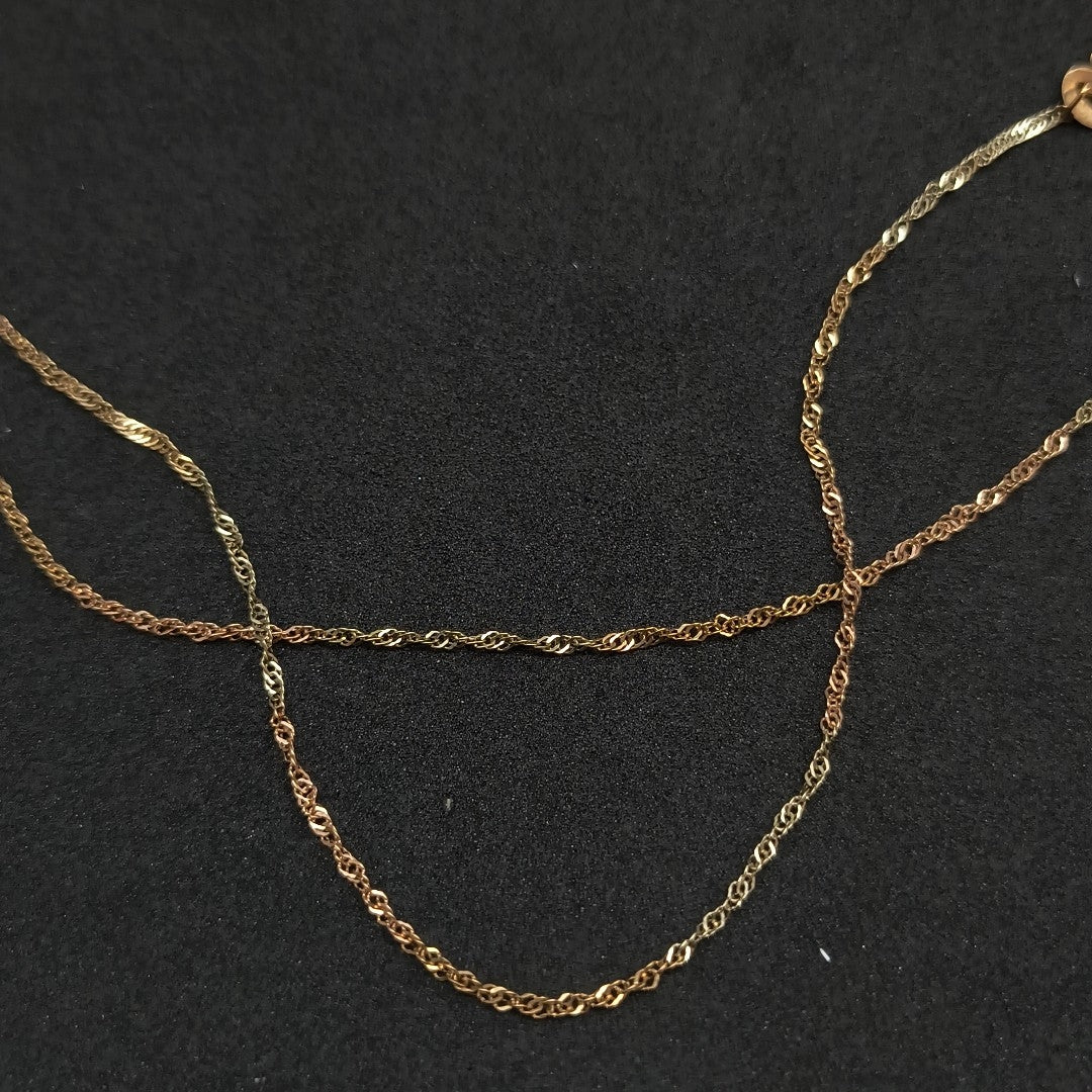 CADENA, DIJE ORO COMBINADO 10 K 1.9 GRMS (SEMINUEVO)