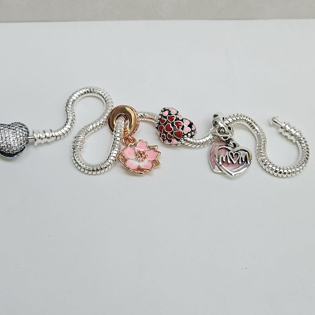 PULSERA TEJIDO ARTICULADA CON CHARMS PLATA .925 21 CM 15.2 GR (NUEVO)